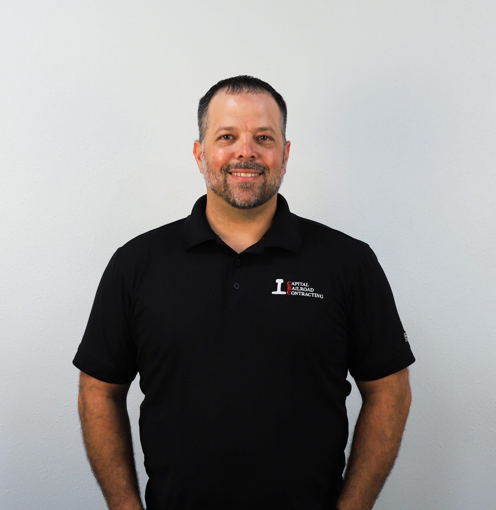 Man in black polo shirt