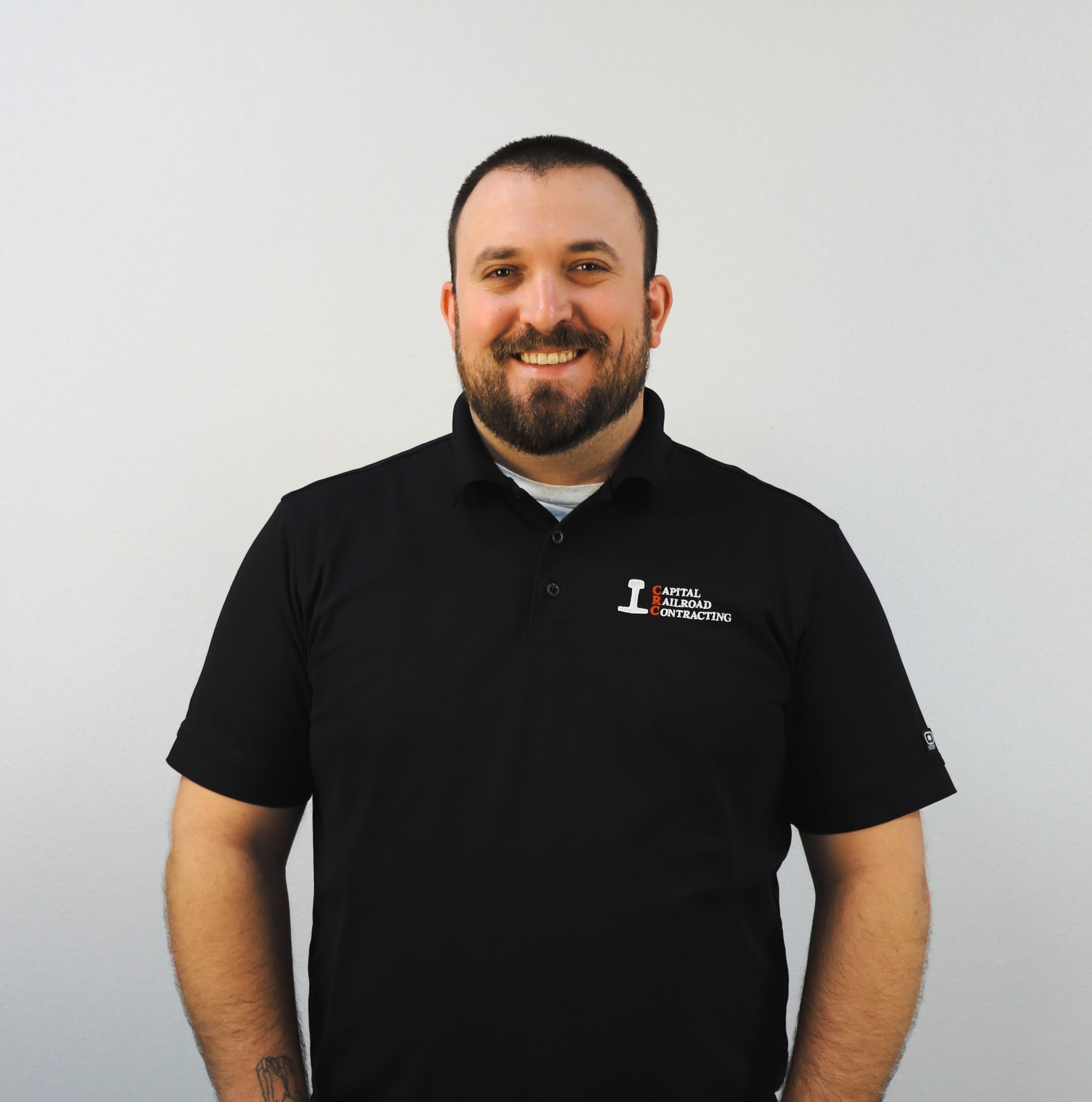 Person in black polo shirt