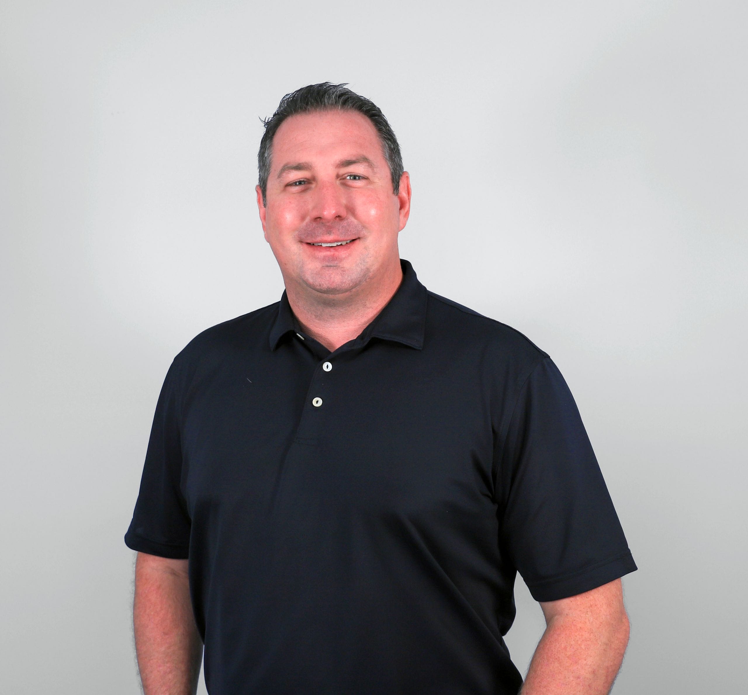 Man in black polo shirt