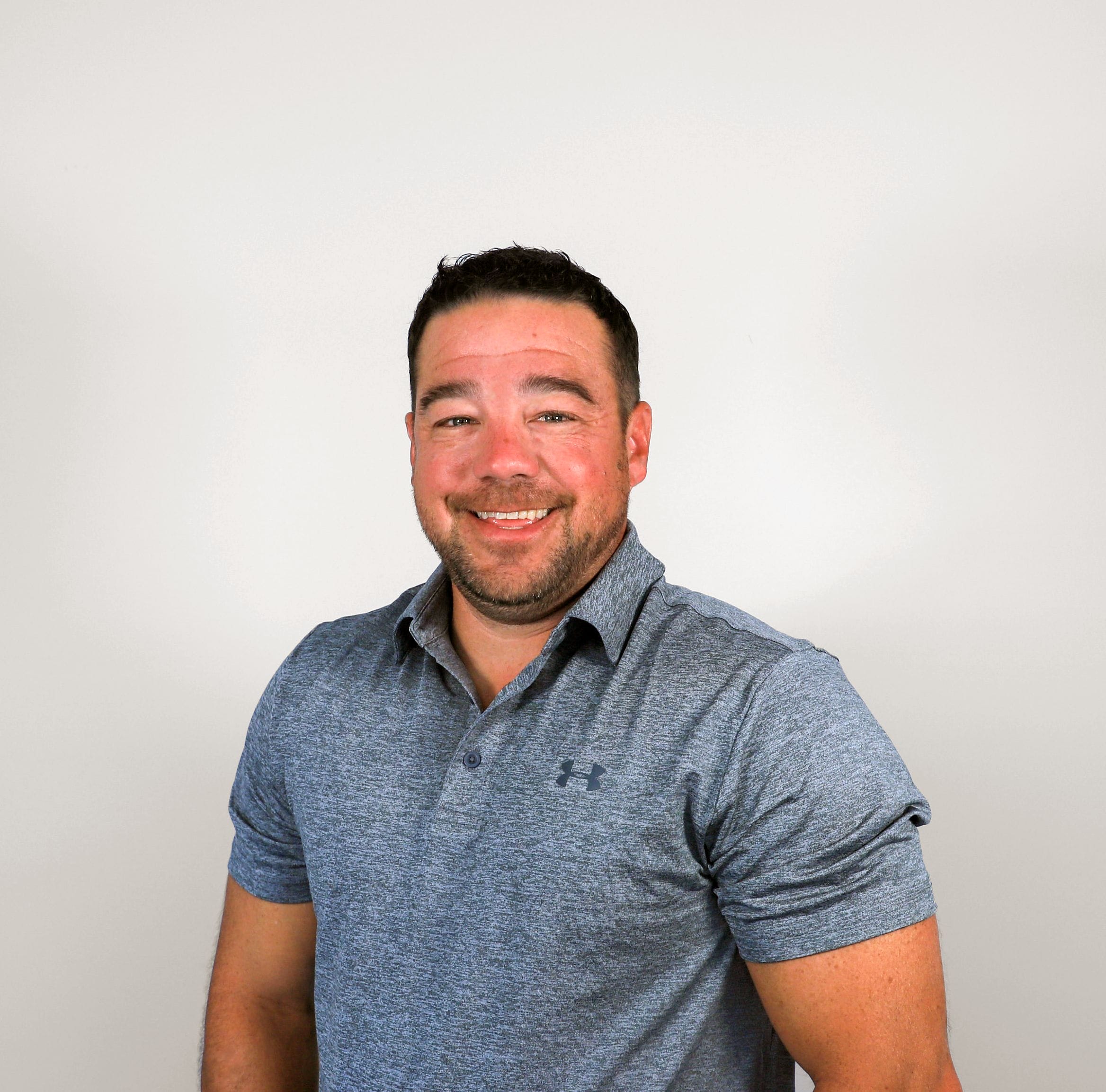 Man in gray polo shirt